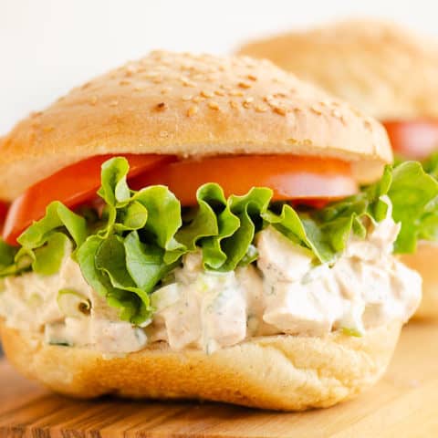 smoked chicken salad piled on sesame bun with lettuce and tomato