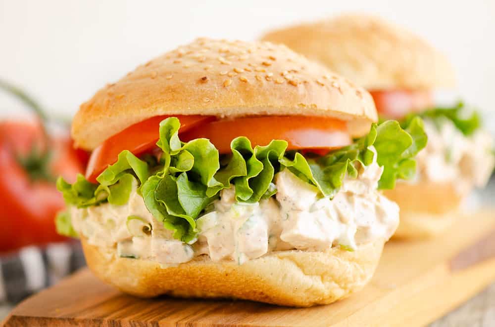 smoked chicken salad piled on sesame bun with lettuce and tomato