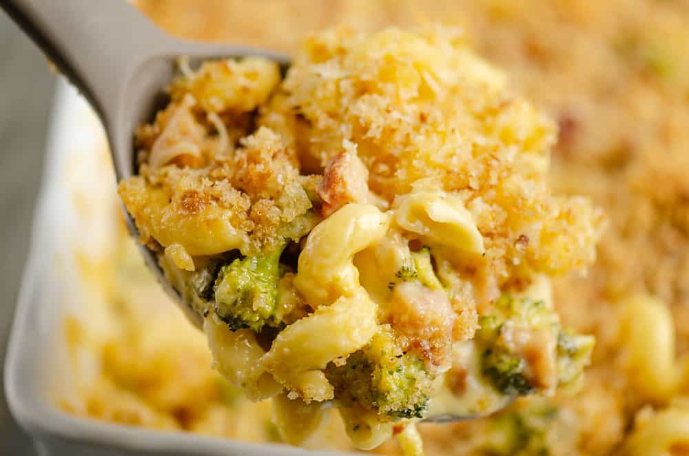 mac and cheese with broccoli and ham on serving spoon