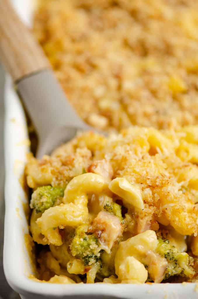 mac and cheese with broccoli and ham scooped out of casserole