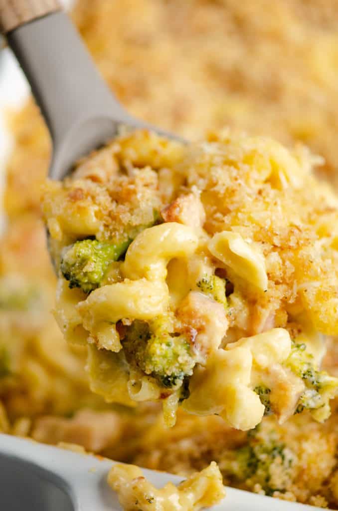 mac and cheese with broccoli and ham on serving spoon