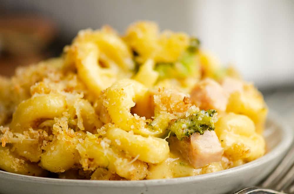 mac and cheese with broccoli and ham on plate with fork