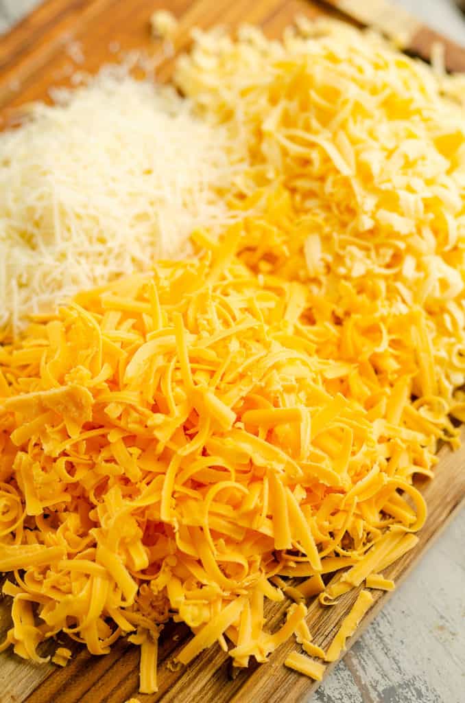 shredded cheese on cutting board