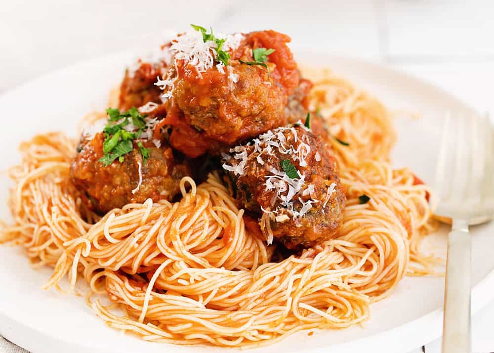 air fryer meatballs over pasta on plate