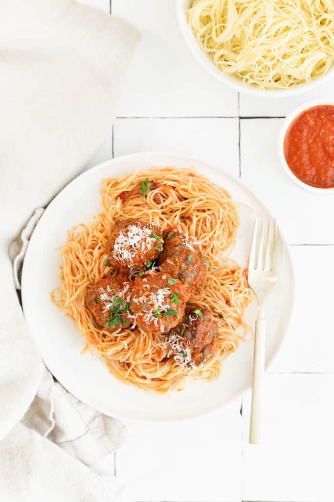 spaghetti and air fryer meatballs on white plate