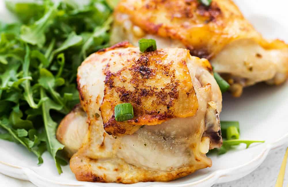 crispy chicken thighs on dinner plate
