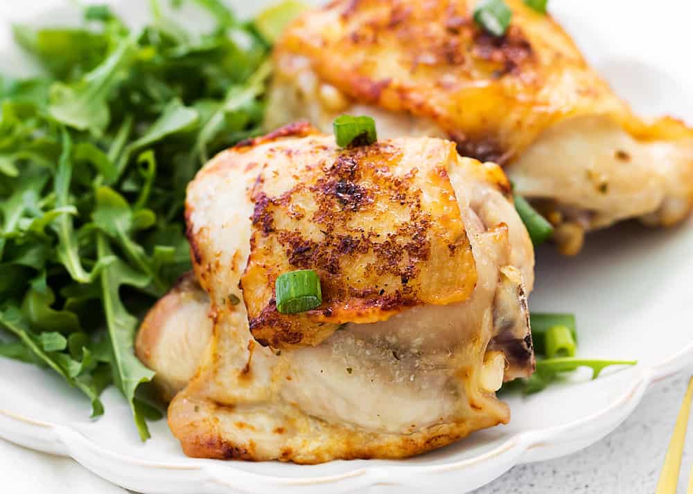 crispy chicken thighs on dinner plate