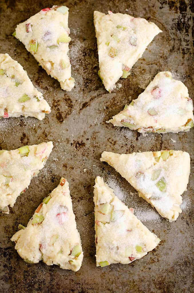 rhubarb scones cut and separated on cookie sheet