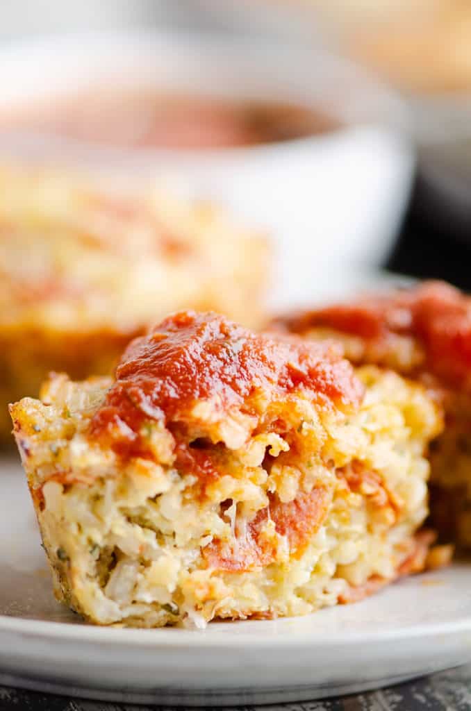 half of pizza rice muffin on plate