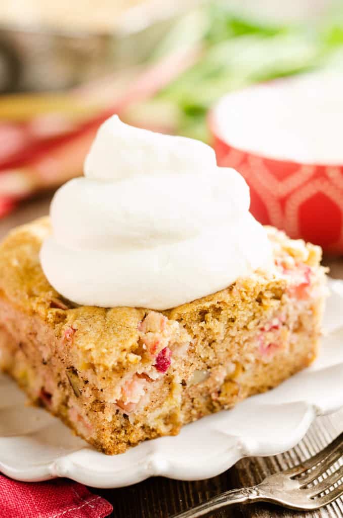 rhubarb cinnamon cake topped with homemade whipped cream