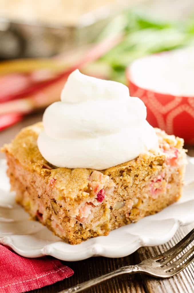 rhubarb pecan cake topped with whipped cream