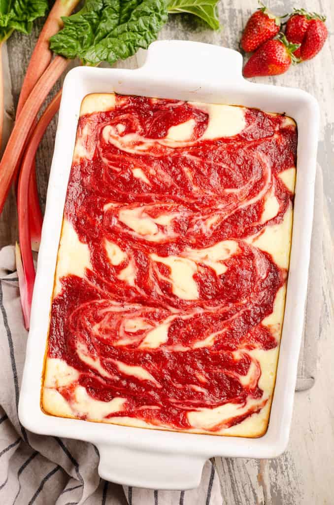 strawberry rhubarb cheesecake swirl bars in 9x13 pan