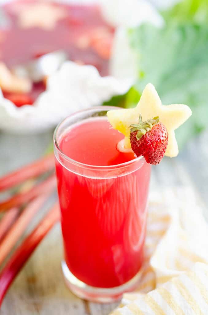 strawberry rhubarb juice next to punch bowl