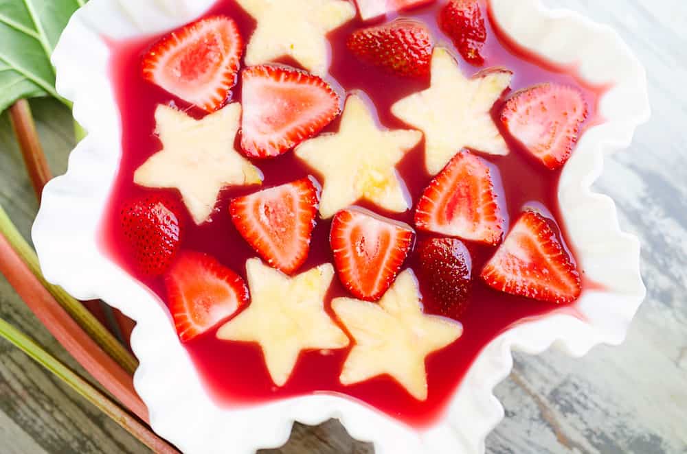 strawberry rhubarb punch in bowl with fresh fruit