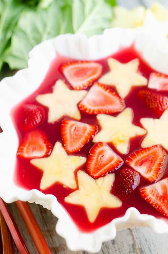 strawberry rhubarb punch in bowl with fresh fruit