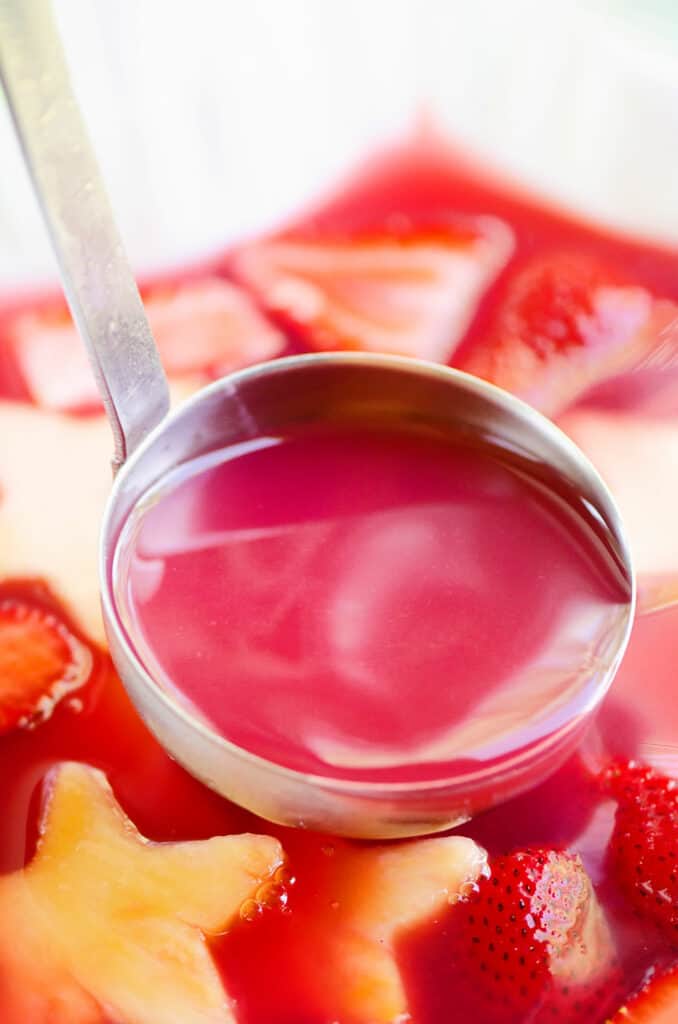 strawberry rhubarb punch in ladle