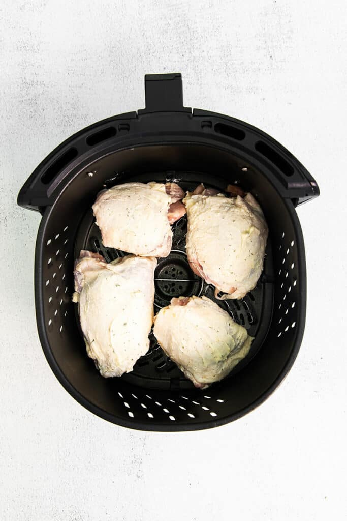 chicken thighs in air fryer basket