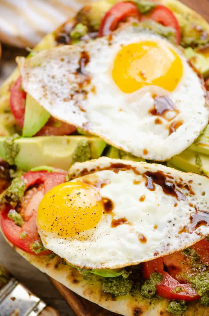 caprese flatbread topped with eggs