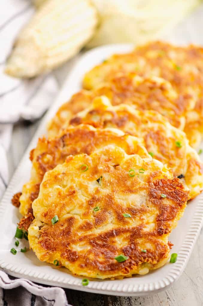 white platter with sweet corn fritters