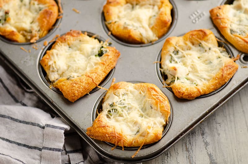 chicken broccoli crescent cups in muffin tin on table