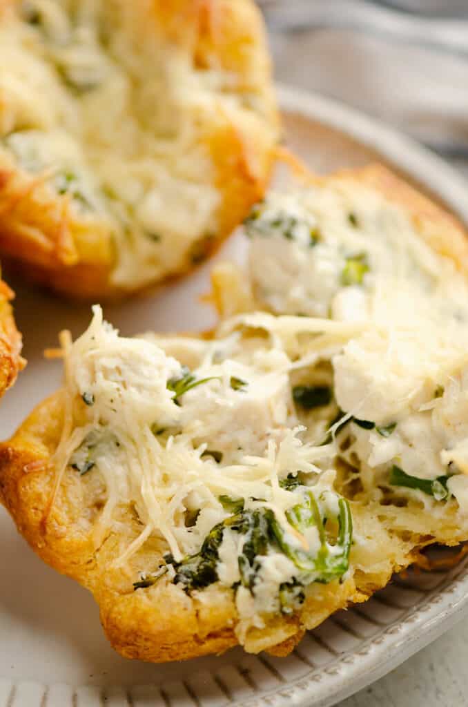 chicken broccoli crescent cups broken in half on plate