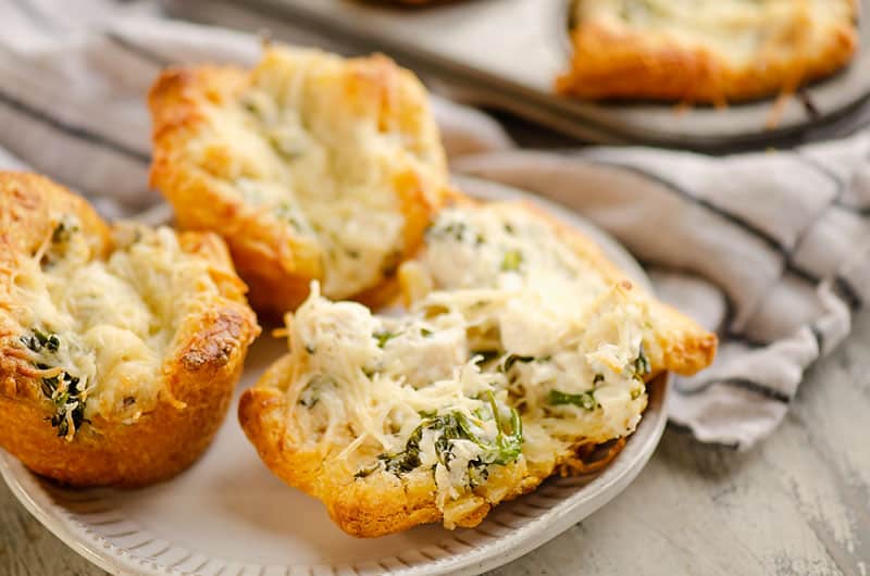 chicken broccoli crescent cups broken in half on plate