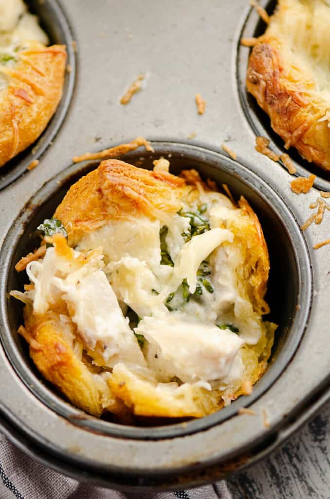half of chicken broccoli crescent cup in muffin tin