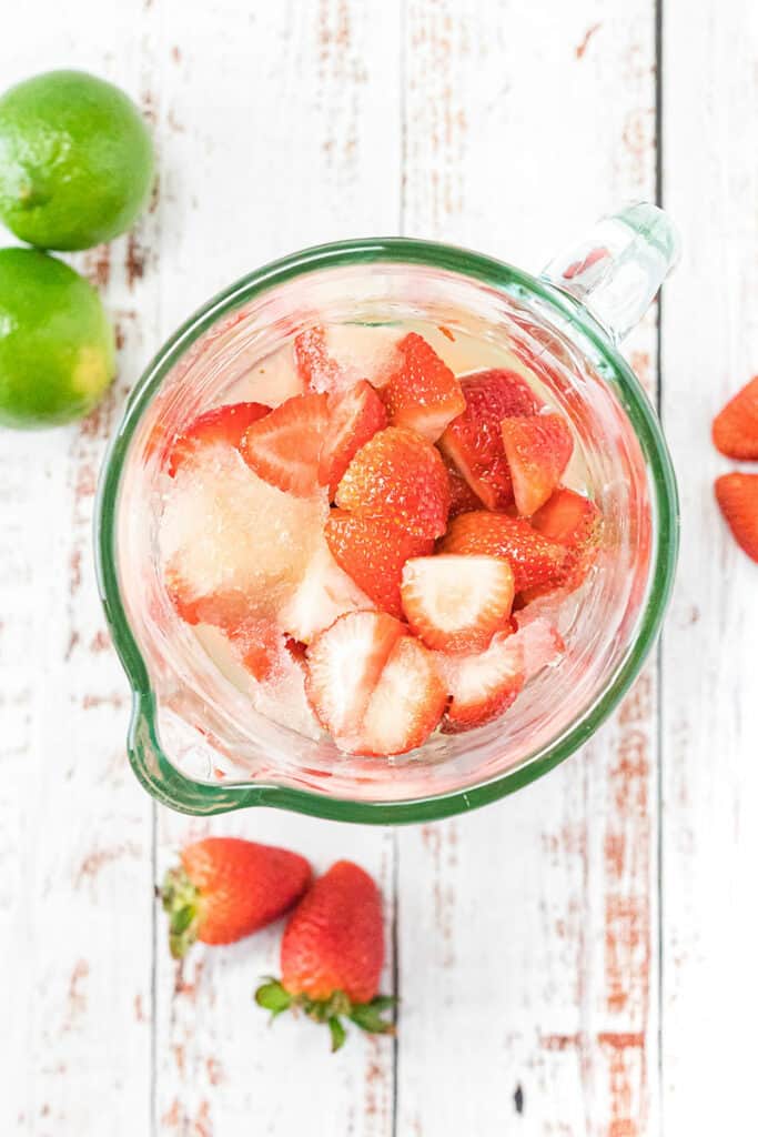 blender with strawberries and limeade