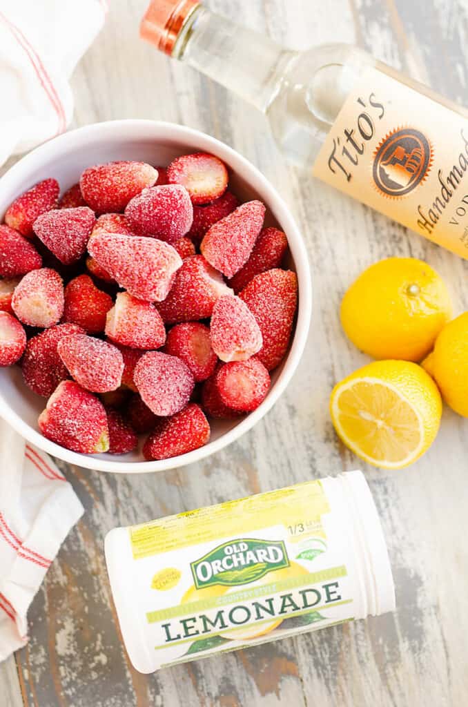 frozen strawberry vodka lemonade ingredients on table