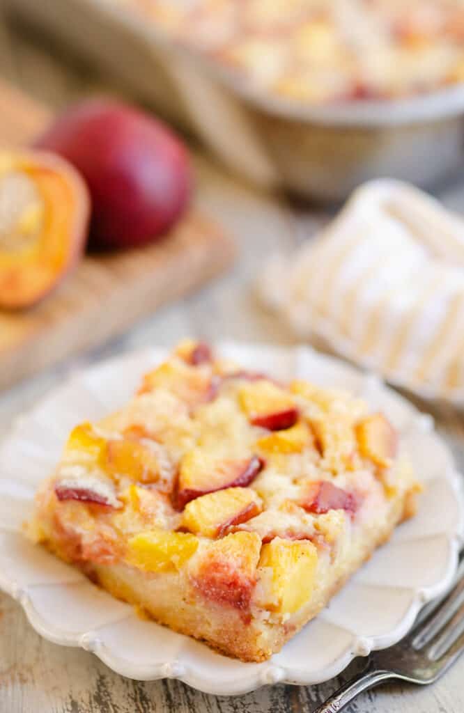 slice of peach custard dessert on table