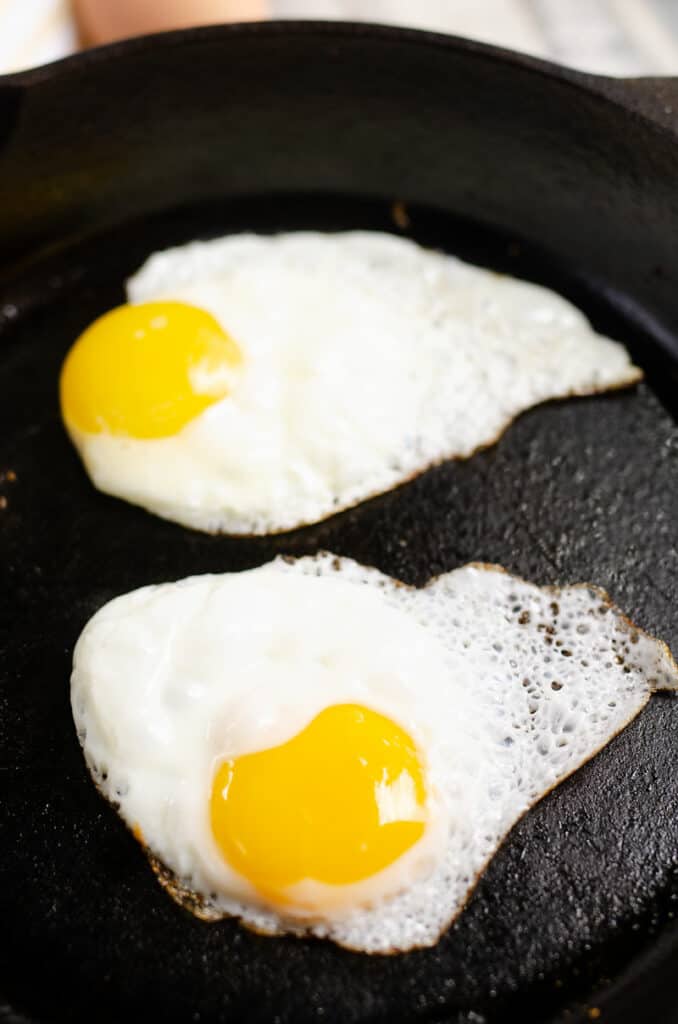 two egg fried in cast iron skillet