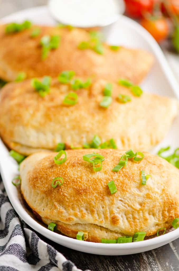 buffalo calzones topped with green onions