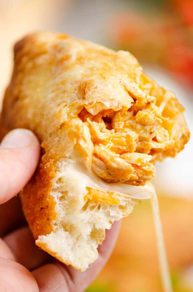 piece of buffalo chicken calzone with cheese pull