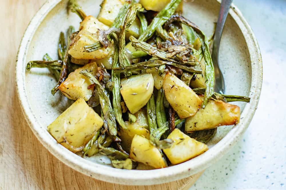 roasted green beans and potatoes on plate