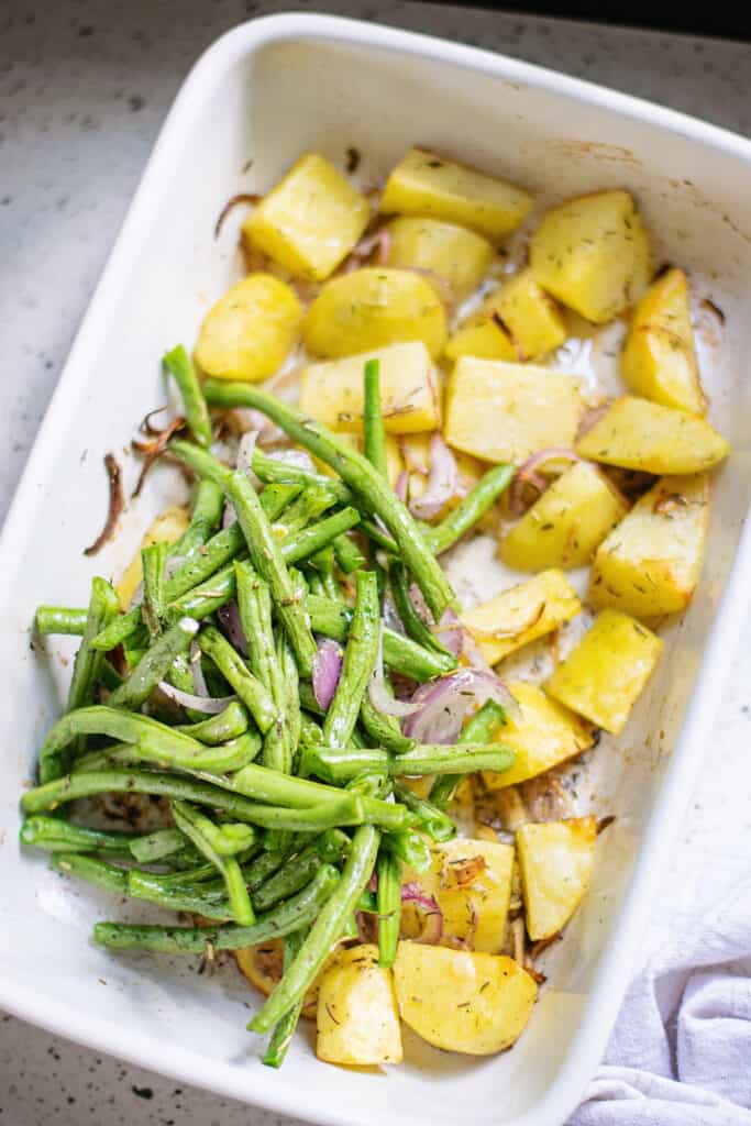 green beans, shallots and potatoes in baking dish