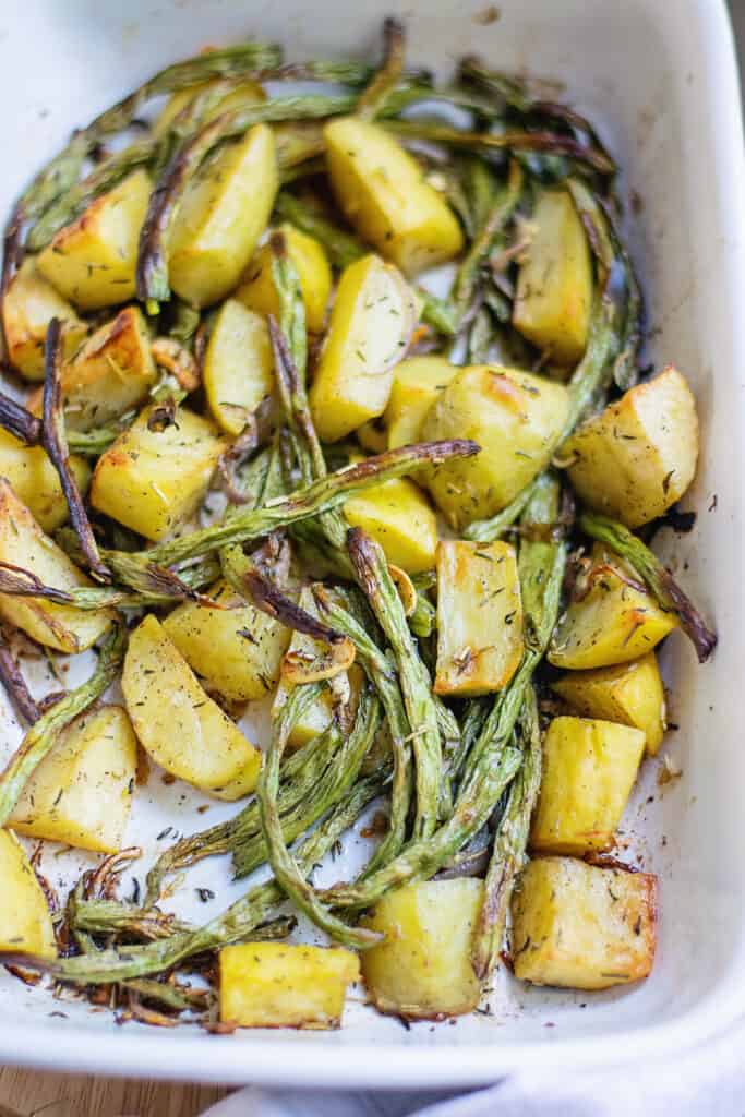 roasted green beans and potatoes in baking dish