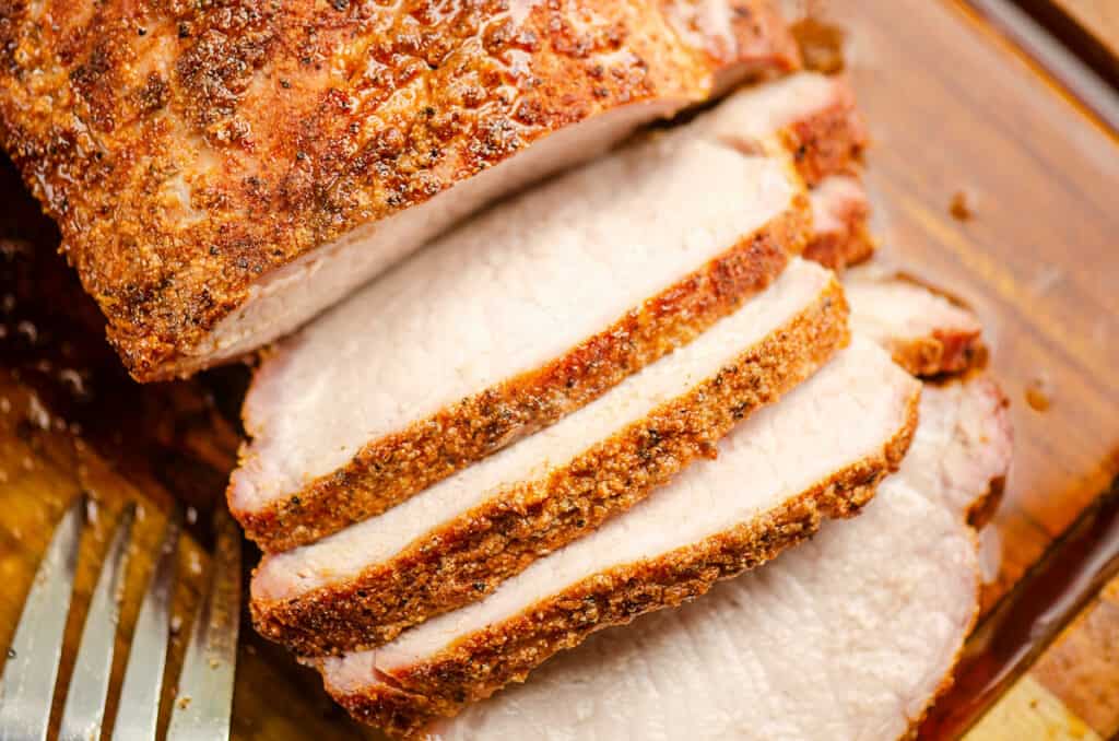 pork loin sliced on cutting board