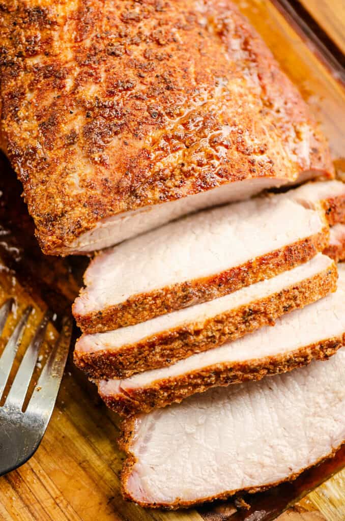 pork loin on cutting board sliced