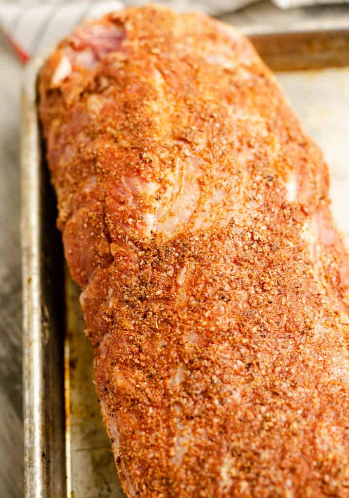 pork loin seasoned with mustard and everything rub on sheet pan