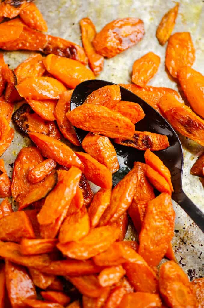 oven roasted carrots on serving spoon