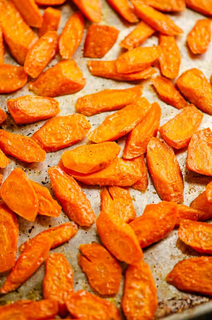 carrots roasted with salt and pepper on baking sheet