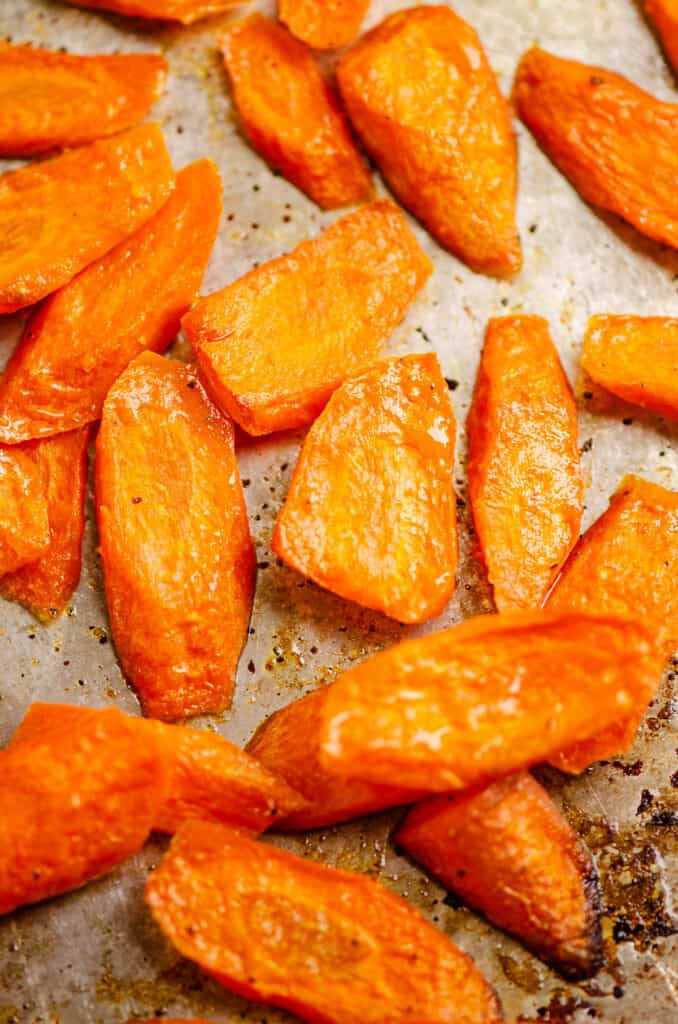 roasted carrot slices on baking sheet