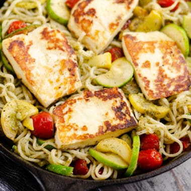 grilled halloumi cheese and vegetable pasta in pan