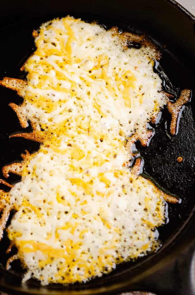 Mexican blend cheese caramelized in cast iron skillet