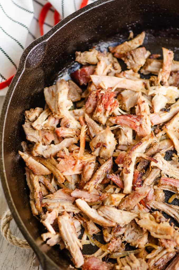 pork carnitas sautéed in cast iron pan