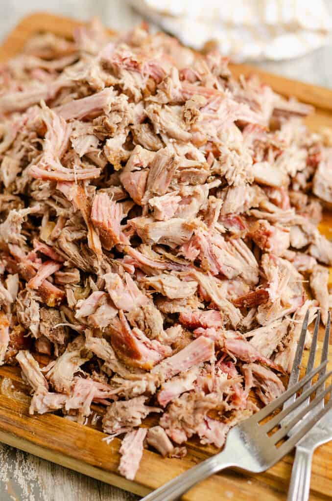 pork carnitas shredded on cutting board