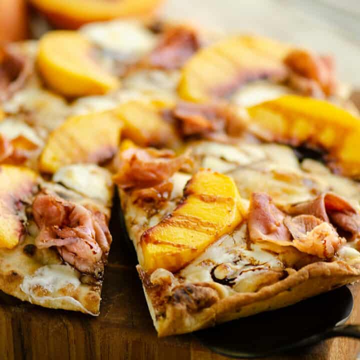 slice of peach pizza on server