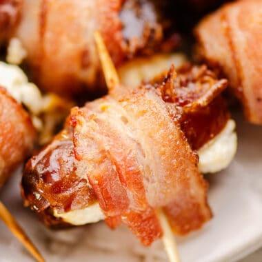 crispy bacon wrapped goat cheese date on platter