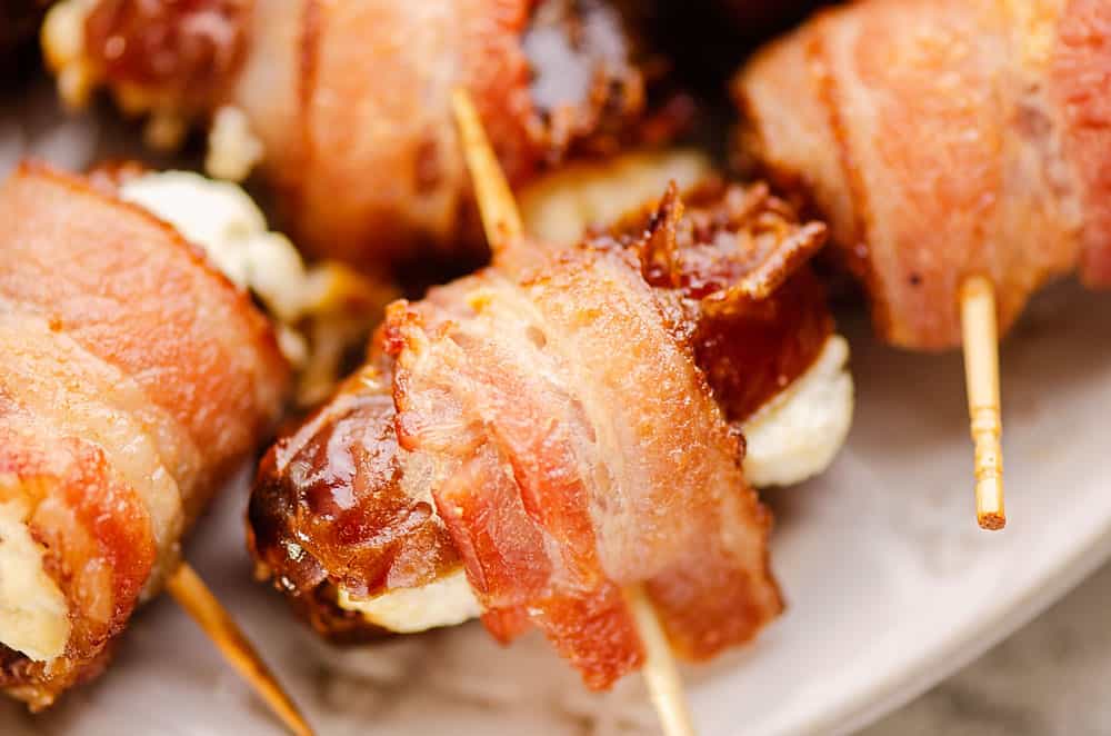 crispy bacon wrapped goat cheese date on platter