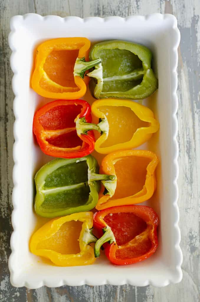 roasted bell peppers in baking dish